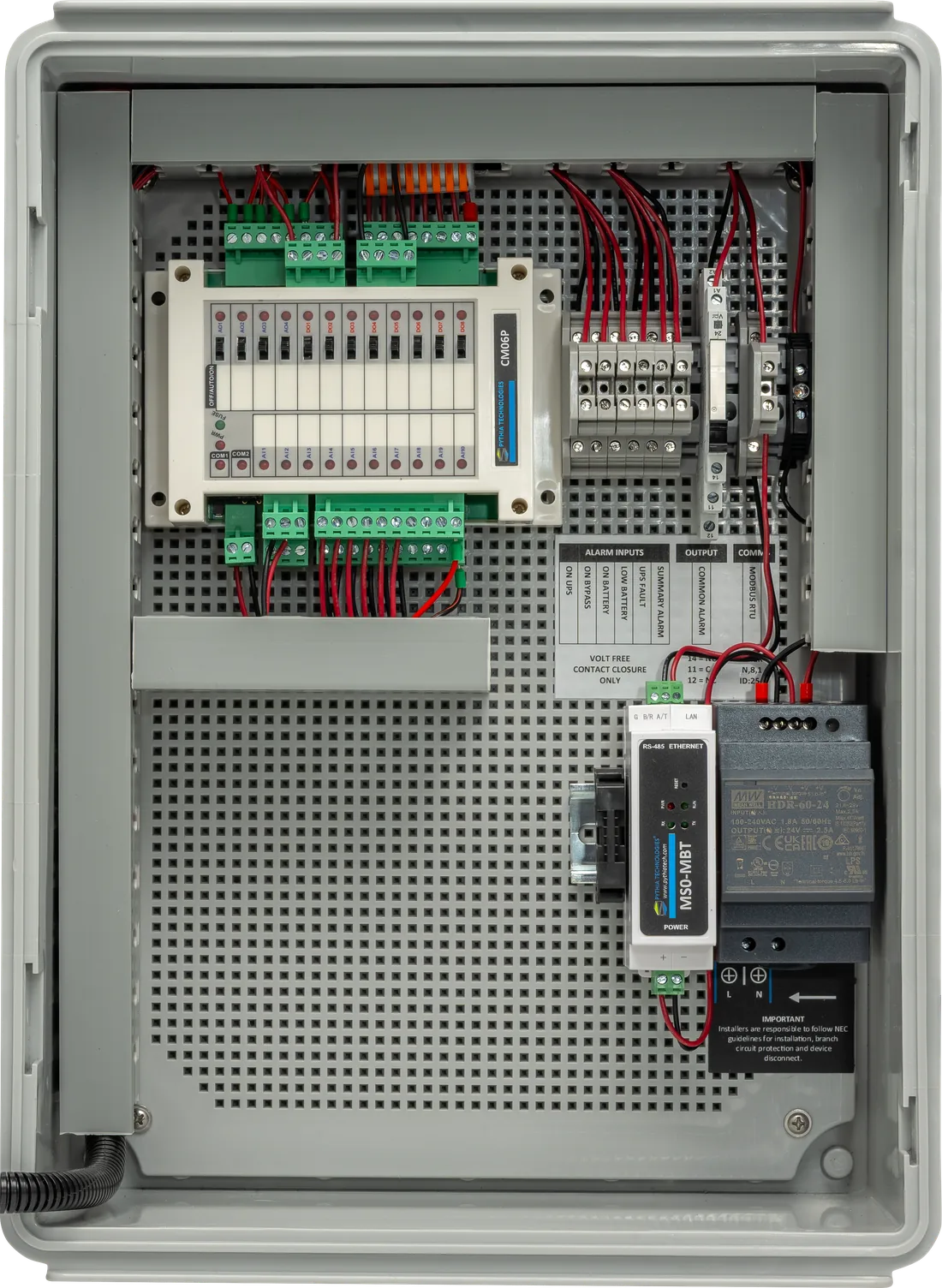 Inside the Pythia UPS Remote Status Panel showing the input module, labeled terminals, alarm relay and power supply